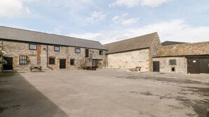 A stone building with multiple rooms and a large open courtyard. - Lathkill Barn (Bakewell)