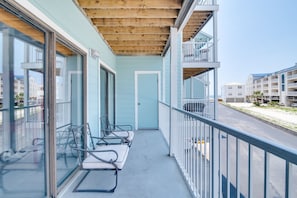 Enjoy the city view from this hotel's balcony, featuring comfortable seating and a relaxing atmosphere.