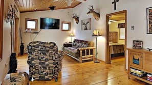 Cabin, Multiple Beds, Patio | Living area | 40-inch TV with cable channels - Little House In The Big Woods (Hayward)