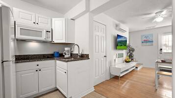 Fridge, microwave, stovetop, coffee/tea maker