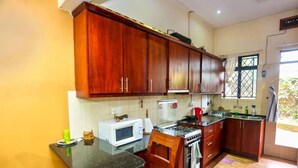 Cottage | Private kitchen | Fridge, microwave, oven, electric kettle - Captivating 2-bed Cottage in Kampala (Kampala)