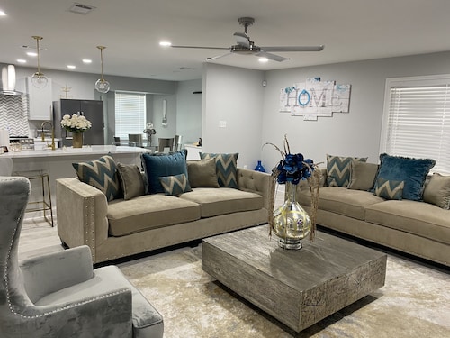 Modern 4 bedroom home with pool.  Sleeps 10-12 comfortable.