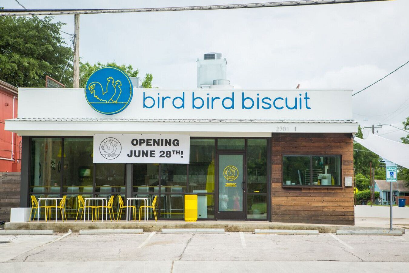 A storefront named "bird bird biscuit" with a sign indicating it is opening on June 28th.