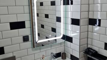 Shower, rainfall showerhead, hair dryer, towels