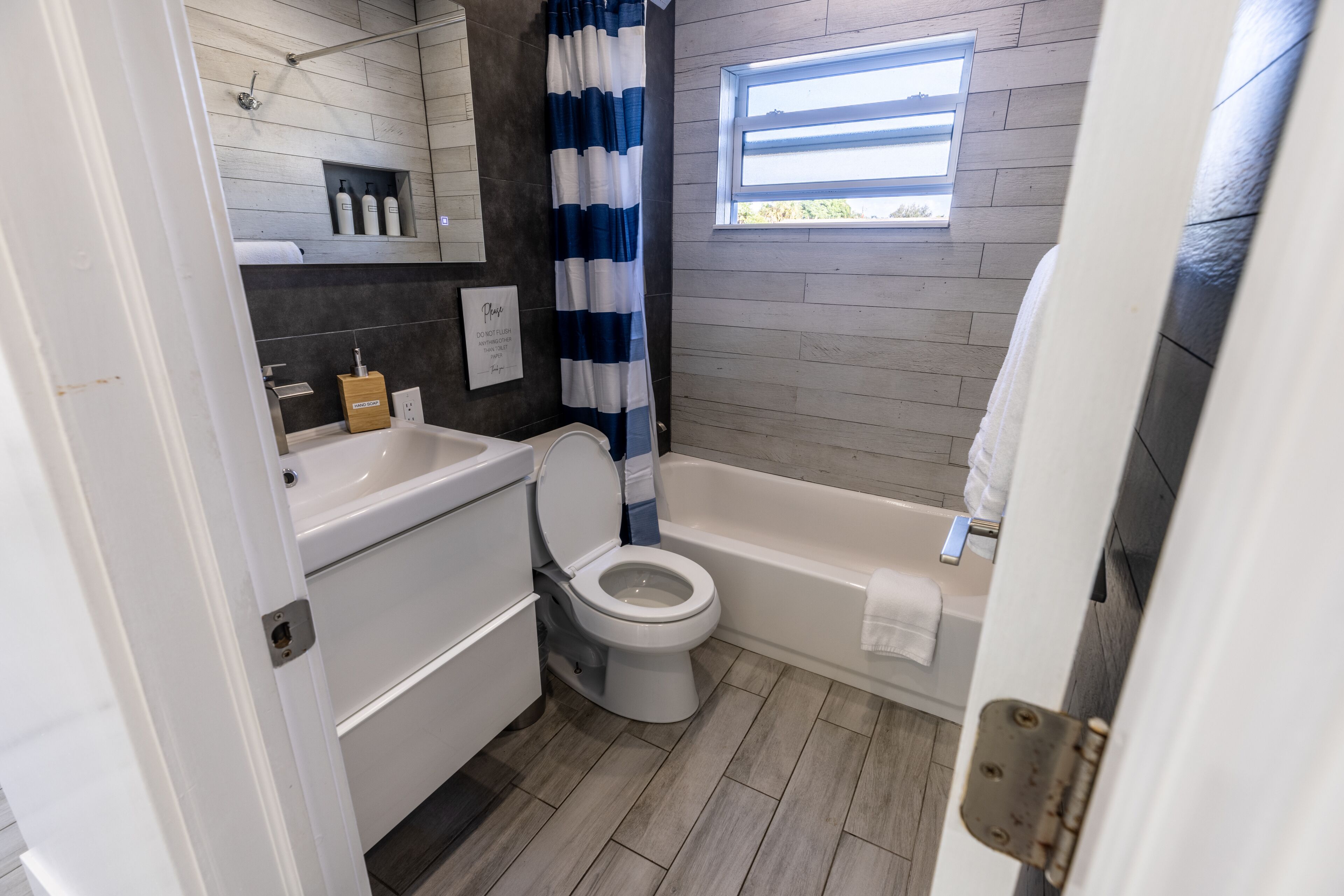 Combined shower/tub, hair dryer, towels, soap