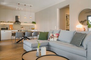 Premium Apartment, 2 Bedrooms, Bay View | Living area | 42-inch Smart TV with cable channels, TV - Kappa Suites (Kefalonia)