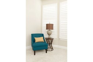 Relax in a cozy corner with a comfortable armchair and a small table for your essentials.