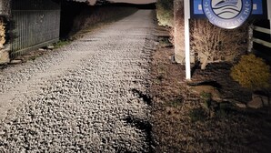 A gravel path leading to a sign for Paradise Landing, Kentucky Lake, Tennessee. - Reconnect with nature at this unforgettable escape (RV NOT INCL'D). (Clifton)