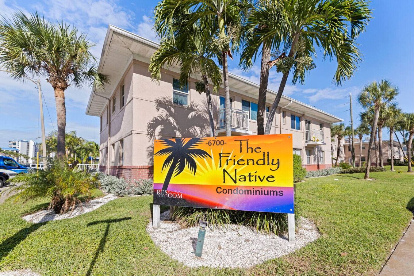 A sign for The Friendly Native Condominiums with a contact number 6700.