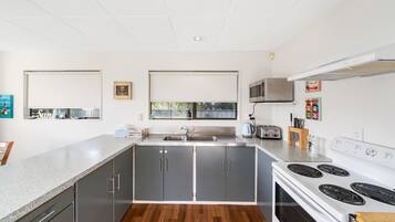 Fridge, microwave, toaster, cookware/dishes/utensils