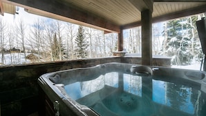 A hot tub with a view of a snowy forest. - Double Eagle by Park City Vacations (Park City)