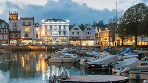 A marina with boats docked, a building with 'ROYAL' signage, and a waterfront view. - 3 The Drive, Hillfield Village (Dartmouth)