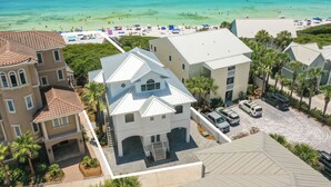 A coastal residential area with houses, a beach, and clear blue water. - Gulf Front Updated Coastal Home 1 mile from Seaside (Santa Rosa Beach)
