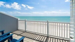 A balcony with a view of the beach and ocean. -  Gulf Front on a ISLAND, 1 pet, tennis, pickleball,sup,kayak. POOL is CLOSED (Placida)