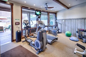 A gym with treadmills, elliptical machines, a stationary bike, and free weights. - Silver Star 4302 | Apres Ski Hot Tub (Park City)