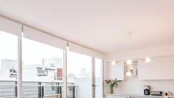 Superior Apartment | Living area | 32-inch flat-screen TV with cable channels, TV