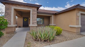 A two-story house with a stone facade, a front porch, and a well-maintained garden with agave plants. - Phx Escape CENTRAL family pet friendly 4 bd sleeps 10 (Phoenix)