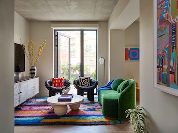 Room (Your Majesty) | Living area | 43-inch Smart TV with digital channels, TV, Netflix at Penny Williamsburg