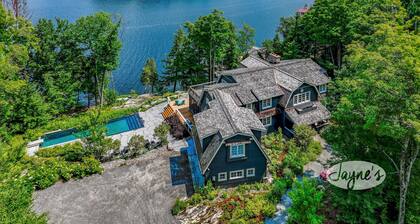 Exquisite 8 bed, 7 bath cottage on Lake Joseph boasting infinity pool + hot tub!