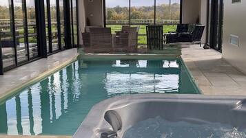 Indoor pool, a heated pool, pool loungers