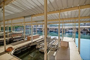 Boats docked along the marina's perimeter, surrounded by water.