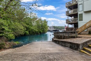 Enjoy waterfront views from the multi-level building with balconies and access to a dock.