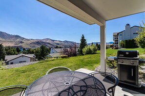 Enjoy al fresco dining with a barbecue grill and mountain views.