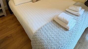 Iron/ironing board, travel cot, bed sheets