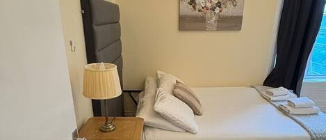 Iron/ironing board, travel cot, bed sheets