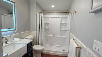 Combined shower/tub, hair dryer, towels, soap