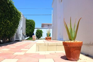 Stroll along the paved walkway to the entrance of this serene outdoor space.