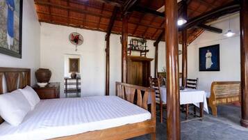 Family Quadruple Room | Living area | 32-inch flat-screen TV with cable channels, TV