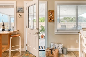 Enjoy a meal with a garden view from the dining table in this open-plan living space.