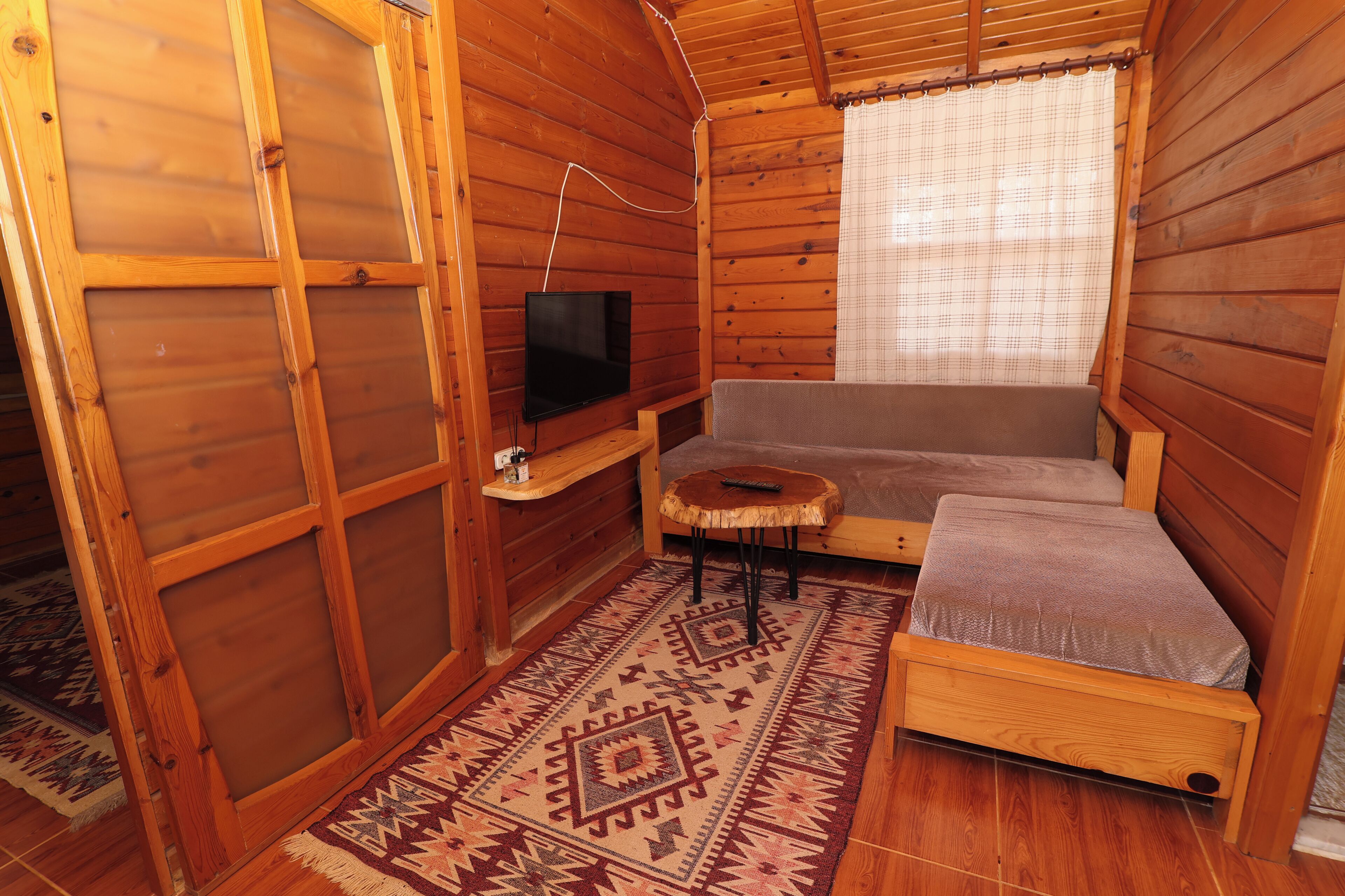Family Bungalow | Living area | 42-inch TV with satellite channels