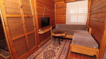 Family Bungalow | Living area | 42-inch TV with satellite channels