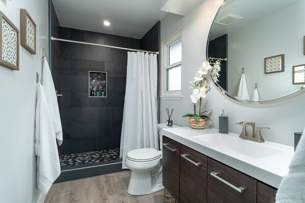 Shower, hair dryer, towels, soap
