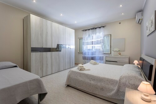 Maison "Bandiera Blu", proche plage, avec climatisation, terrasse et jardin.