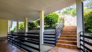 A covered outdoor staircase with a metal railing, leading to a hillside. - Apartment 'with Stunning Views' and Balcony (Tremosine)