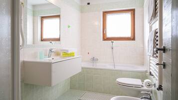 Bathtub, hair dryer, towels