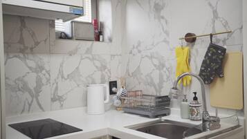 Fridge, microwave, highchair, cookware/dishes/utensils