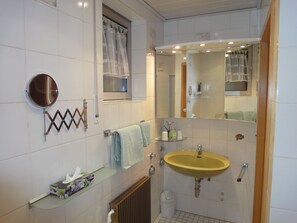 Combined shower/tub, hair dryer, towels, soap