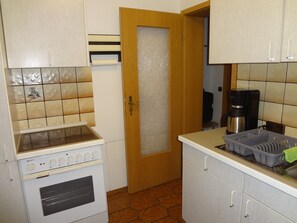 Fridge, microwave, stovetop, coffee/tea maker