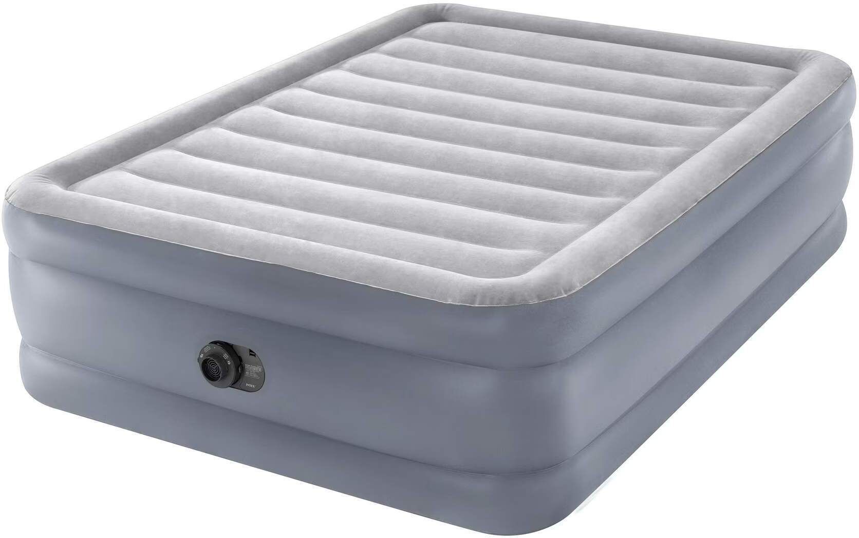 A gray inflatable mattress with a textured surface and a control knob.