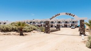 A gated entrance to a building with a sign reading "Paradise Villas." - Paradise Villa 19 by Kivoya (Puerto Peñasco)
