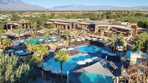 A resort with multiple swimming pools, outdoor seating areas, and a mountainous backdrop. - Luxurious Resort Stay, 2br lock off at Westin Palm Desert (Palm Desert)