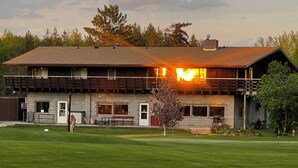 A two-story building with a flat roof and a brick facade. - Large Private Condo on the Golf Course close to Many Lakes! (Cass Lake)