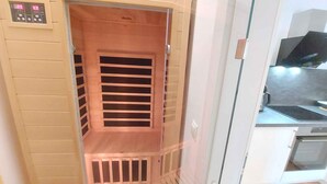 A modern kitchen with a built-in oven and a digital control panel. - Holiday apartment new and cozy (Öblarn)