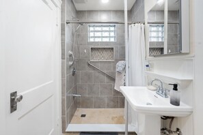 Shower, hair dryer, towels, soap