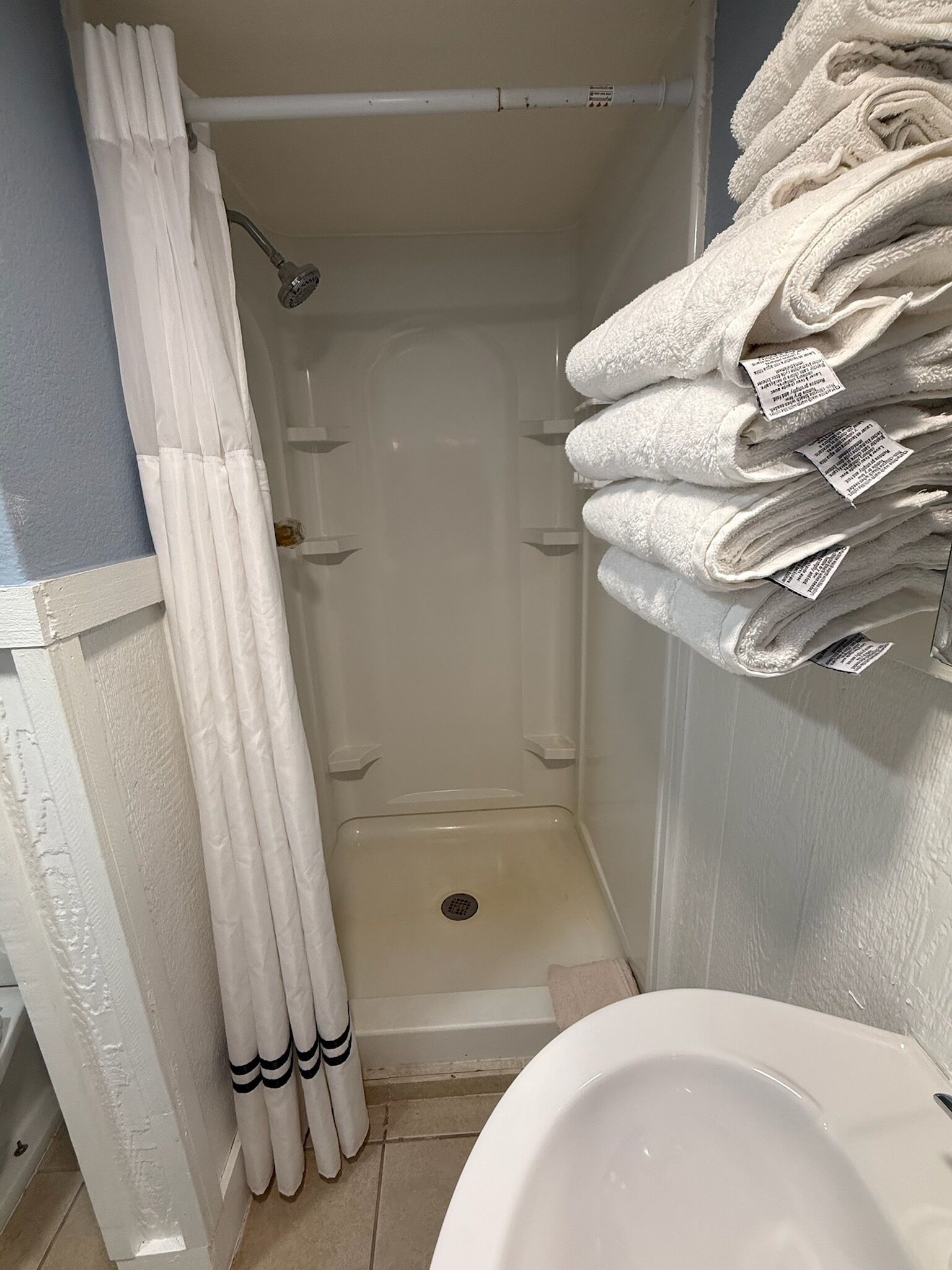 Shower, towels, soap, shampoo