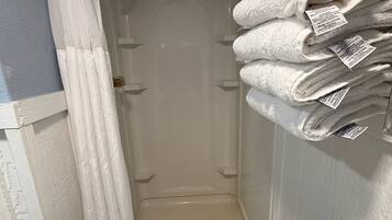 Shower, towels, soap, shampoo